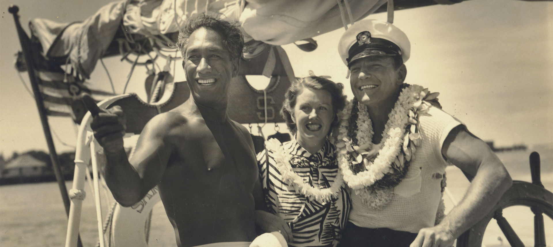 Duke on a boat with happy couple