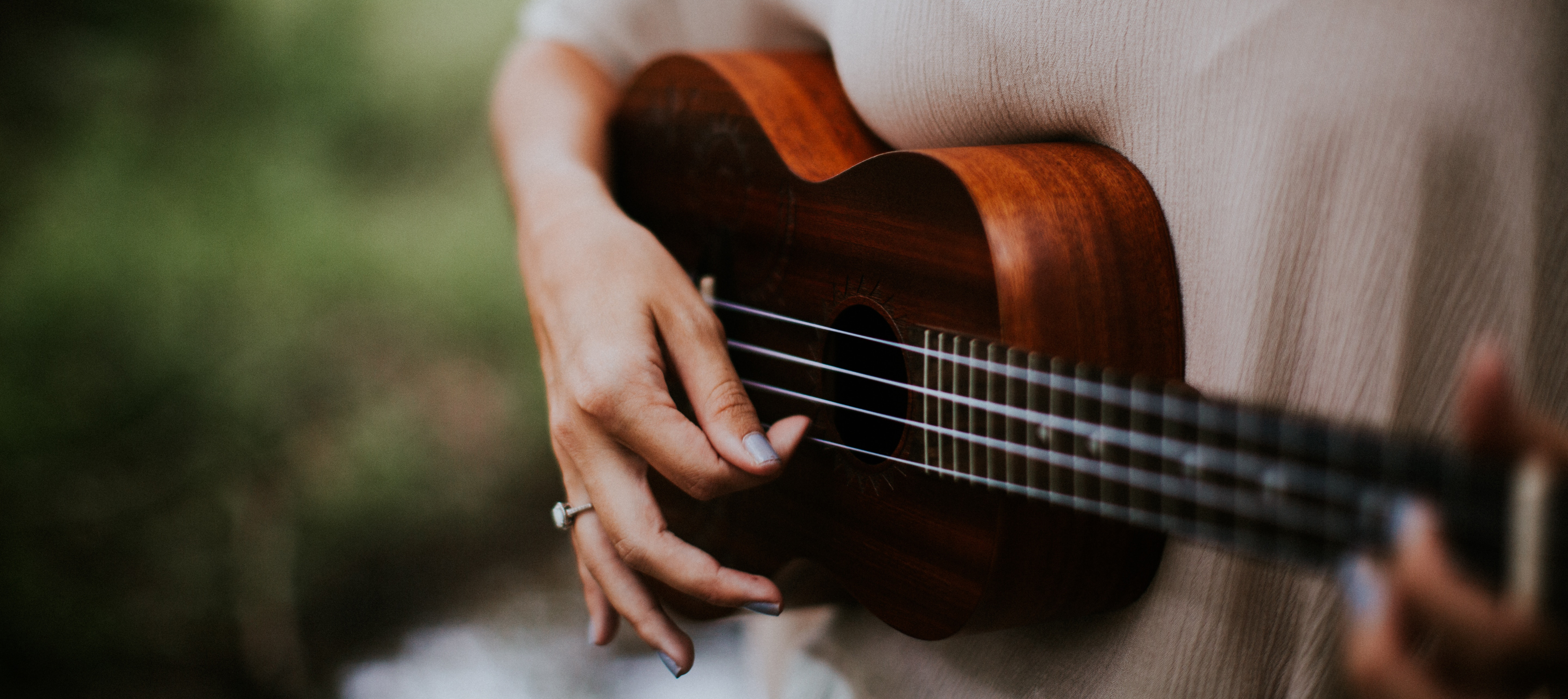 Woman playing the ukulele