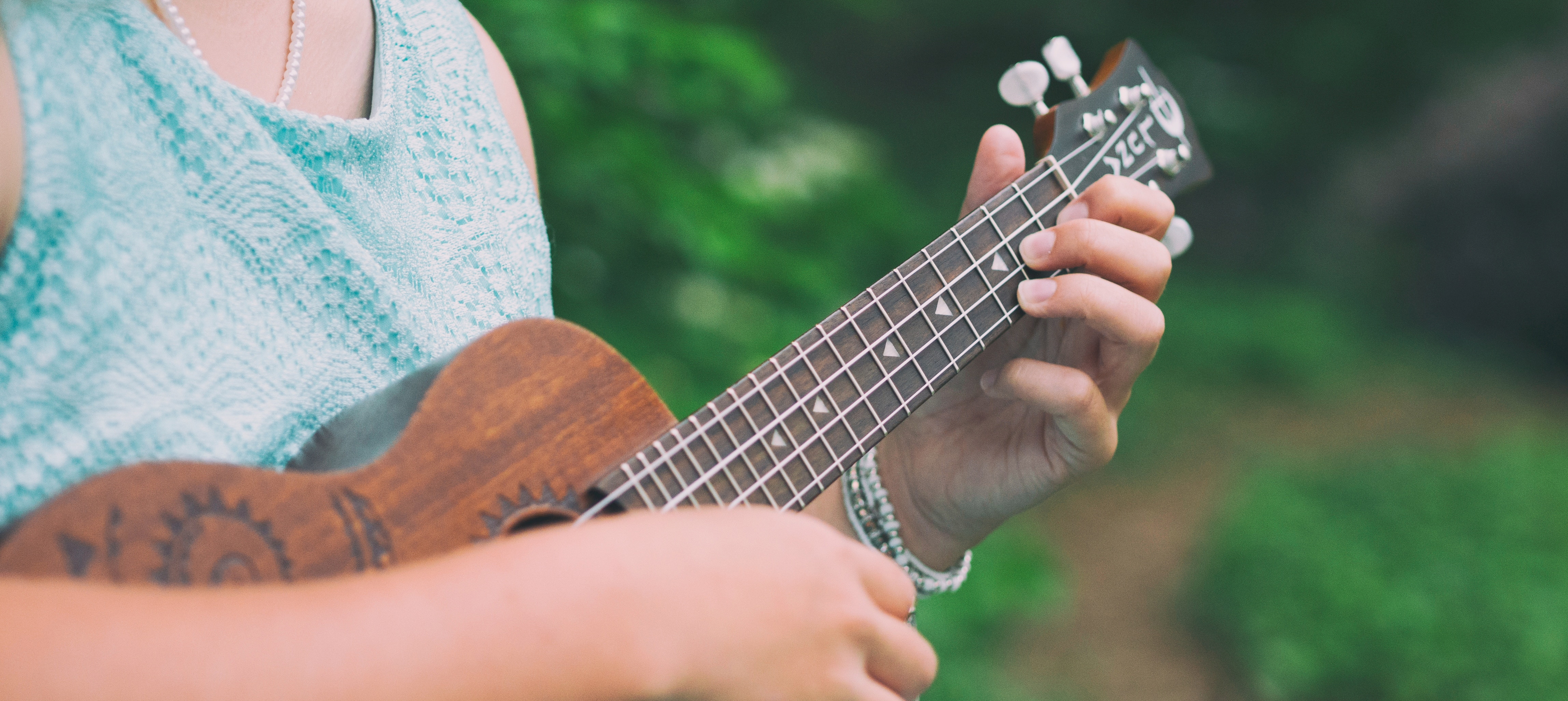 Woman playing a ukulele