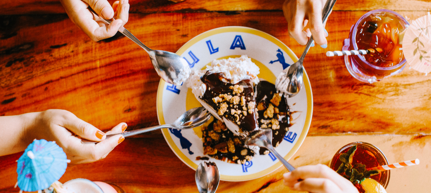 Top-down shot of a Hula Pie being eaten with sporks